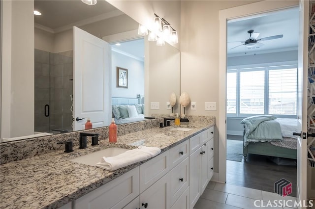 bathroom featuring crown molding, ceiling fan, vanity, and walk in shower