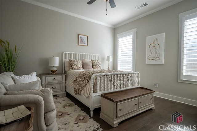 bedroom featuring multiple windows, crown molding, dark hardwood / wood-style floors, and ceiling fan