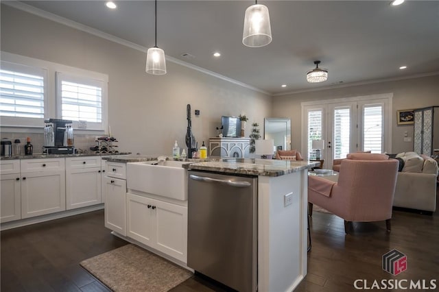 kitchen with light stone counters, hanging light fixtures, white cabinetry, and dishwasher