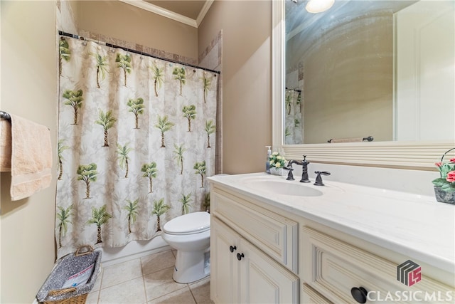 bathroom featuring ornamental molding, vanity, tile patterned floors, and toilet