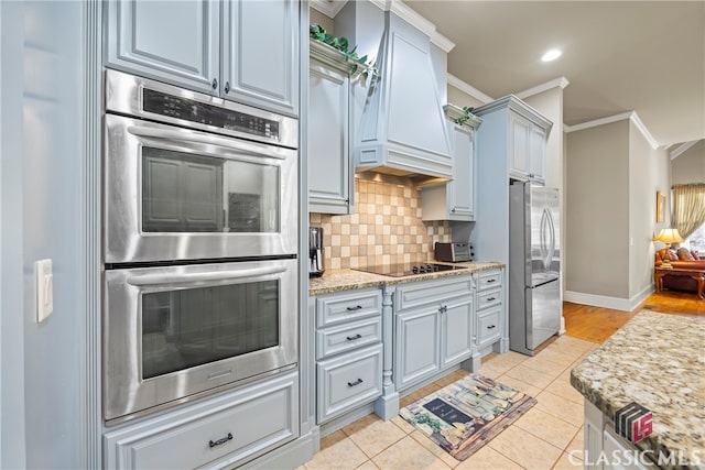 kitchen featuring appliances with stainless steel finishes, tasteful backsplash, ornamental molding, light tile patterned flooring, and custom exhaust hood