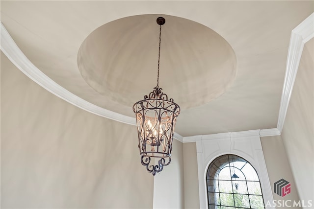 details with crown molding and an inviting chandelier