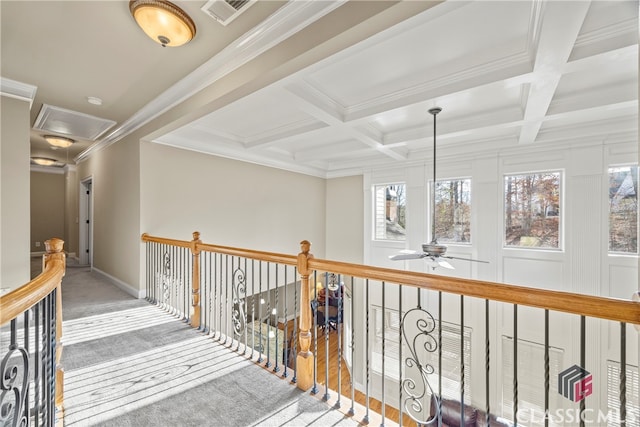 hall featuring beamed ceiling, ornamental molding, and coffered ceiling