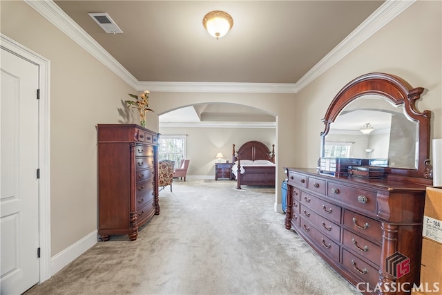 carpeted bedroom with crown molding and multiple windows