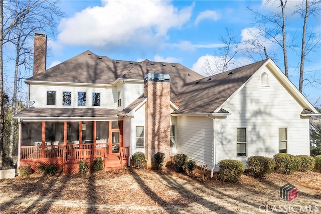 view of front of house featuring a sunroom