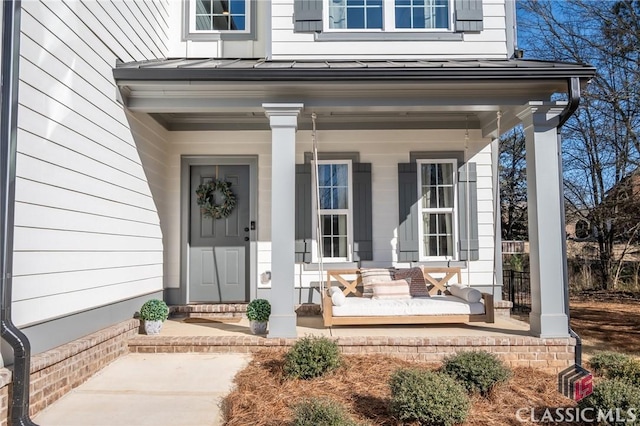 doorway to property with a porch