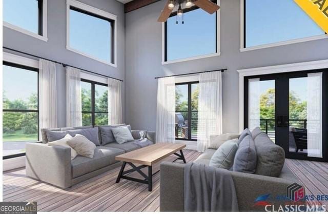 living room featuring a baseboard heating unit, light hardwood / wood-style floors, and french doors