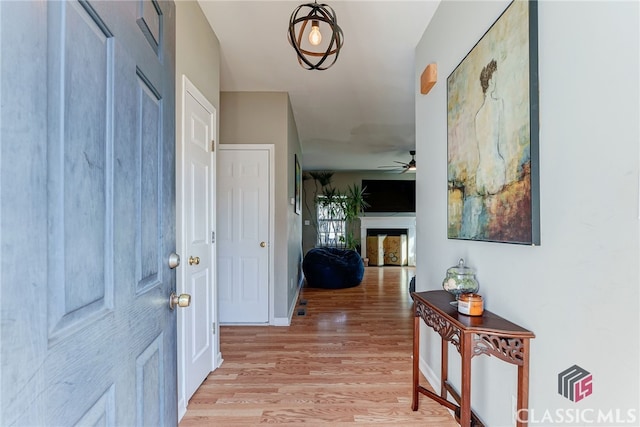 interior space with light wood-type flooring and baseboards