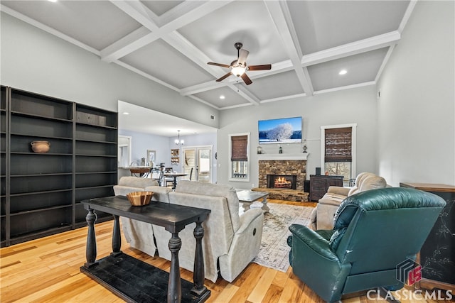 living room featuring hardwood / wood-style flooring, coffered ceiling, and beamed ceiling