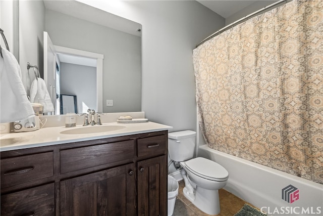 full bathroom with shower / bath combo with shower curtain, tile patterned floors, toilet, and vanity