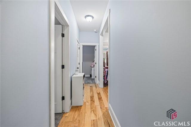 corridor featuring light wood-type flooring