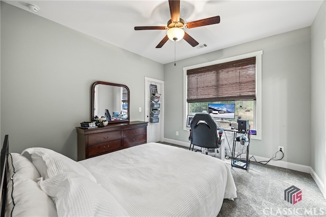 carpeted bedroom with ceiling fan