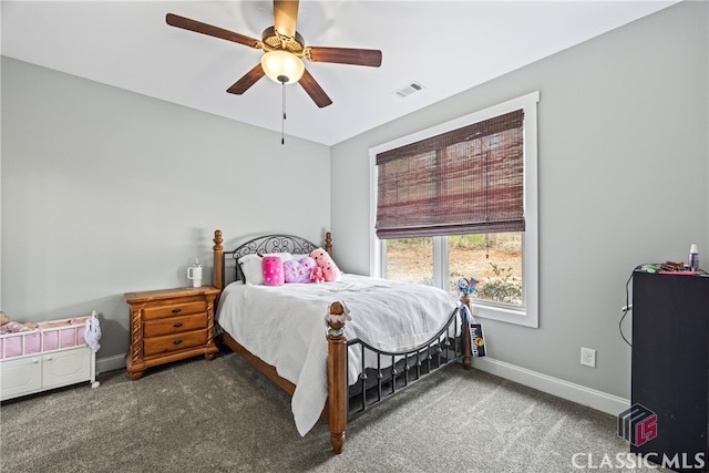 bedroom with ceiling fan and dark carpet