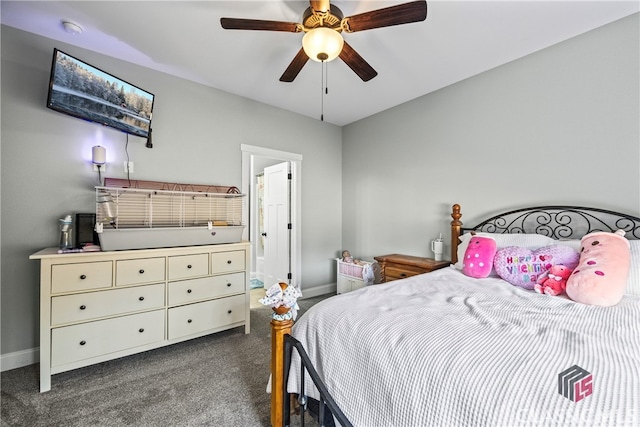 bedroom featuring dark colored carpet, connected bathroom, and ceiling fan