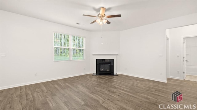 unfurnished living room with hardwood / wood-style floors and ceiling fan