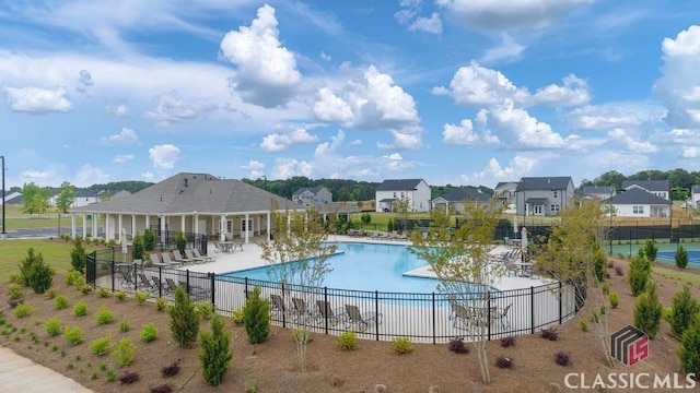 view of swimming pool featuring a patio area