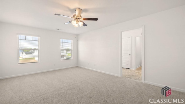 carpeted empty room with ceiling fan