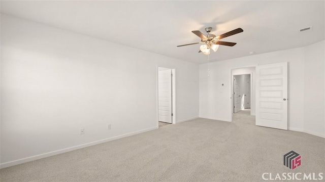 empty room featuring light carpet and ceiling fan