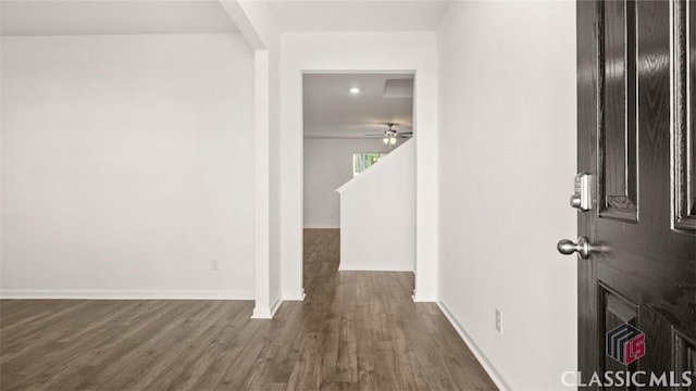 corridor with wood-type flooring