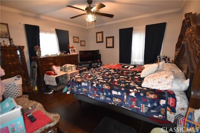 bedroom featuring wood-type flooring, ornamental molding, and ceiling fan