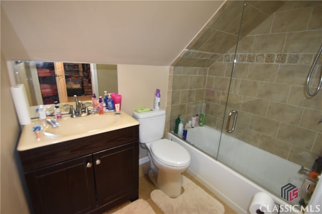 full bathroom featuring enclosed tub / shower combo, vanity, and toilet