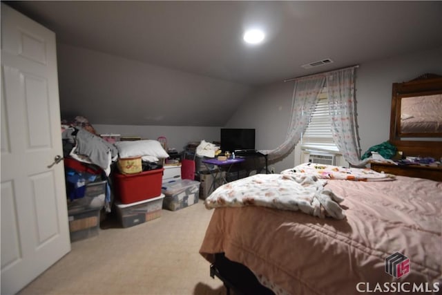 carpeted bedroom featuring lofted ceiling