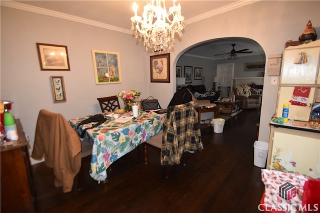 dining room featuring crown molding, hardwood / wood-style flooring, and ceiling fan with notable chandelier