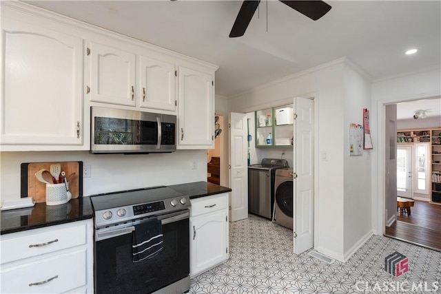 kitchen with white cabinets, washing machine and clothes dryer, ceiling fan, stainless steel appliances, and crown molding