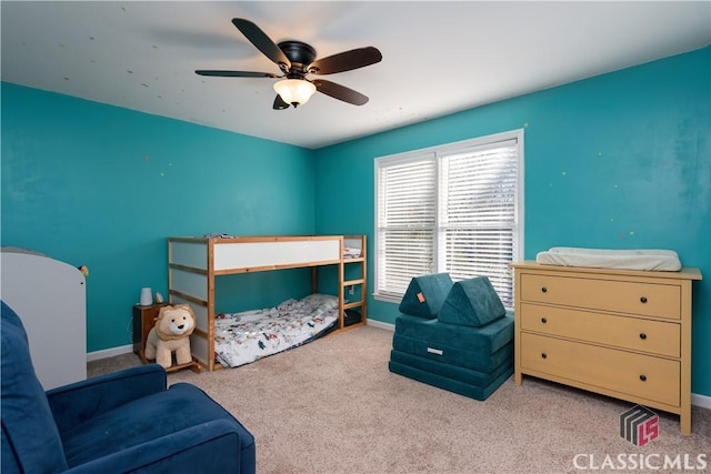 carpeted bedroom with ceiling fan