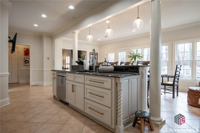 kitchen featuring ornate columns, a center island, hanging light fixtures, light tile patterned floors, and dishwasher