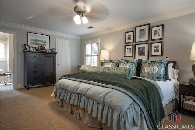 bedroom featuring ornamental molding, carpet, and ceiling fan