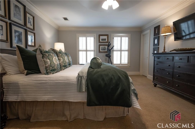 bedroom with light carpet and crown molding