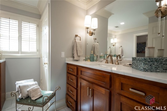 bathroom featuring ornamental molding and vanity