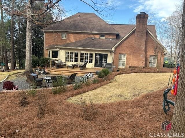 back of property featuring a lawn