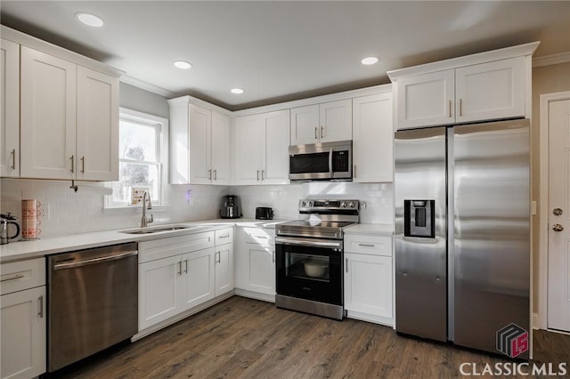 kitchen with sink, white cabinets, and appliances with stainless steel finishes