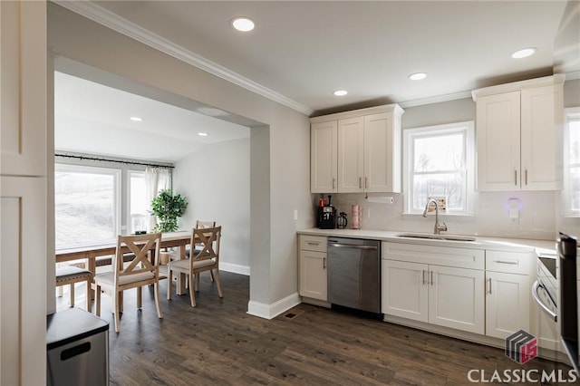 kitchen with sink, ornamental molding, white cabinets, and dishwasher