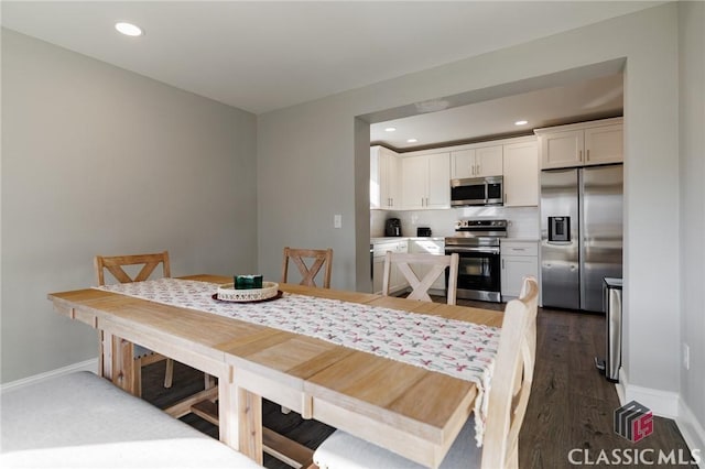 dining area featuring dark hardwood / wood-style flooring