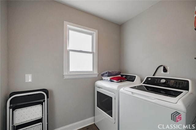 laundry room featuring washing machine and clothes dryer