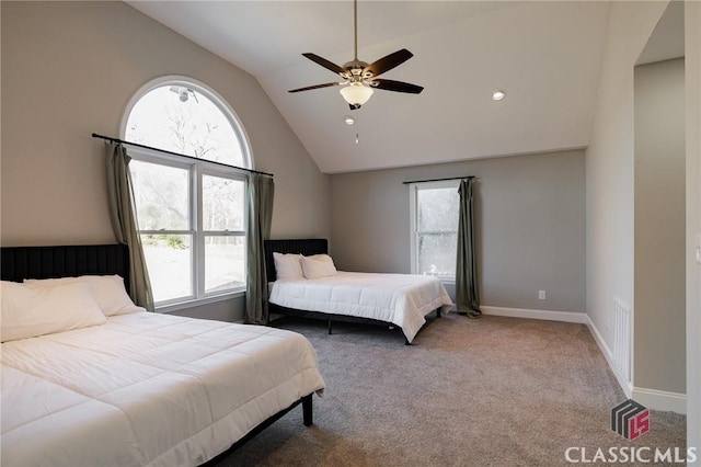 carpeted bedroom featuring multiple windows, high vaulted ceiling, and ceiling fan