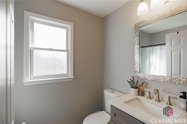 bathroom with vanity and toilet