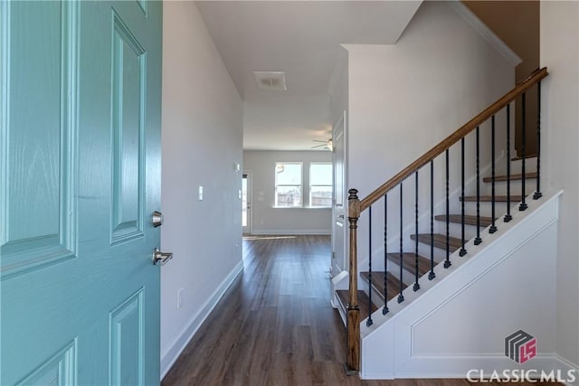 entrance foyer featuring ceiling fan and dark hardwood / wood-style floors