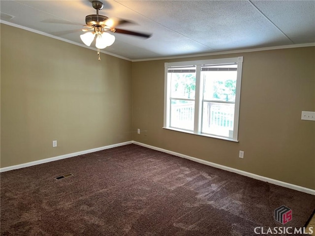 unfurnished room with carpet floors, ornamental molding, and a textured ceiling