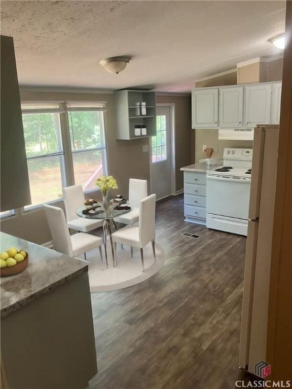 dining space with lofted ceiling and dark hardwood / wood-style flooring