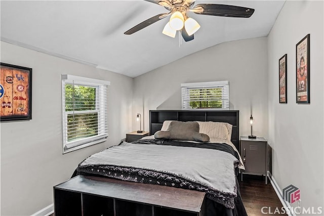 bedroom featuring vaulted ceiling, dark wood-type flooring, and ceiling fan