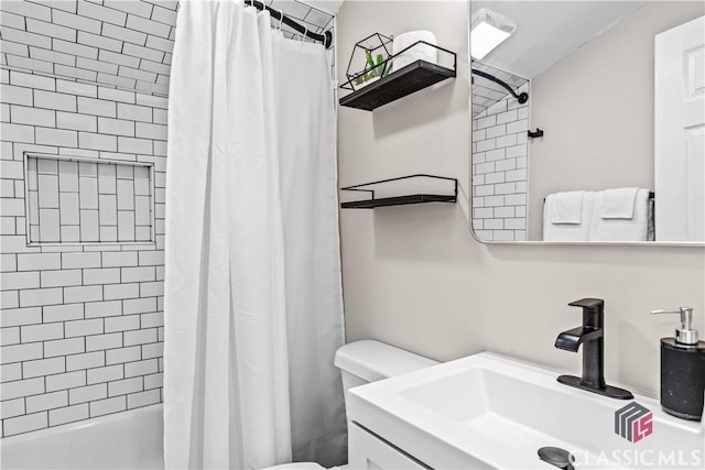 full bathroom featuring shower / bath combination with curtain, vanity, and toilet