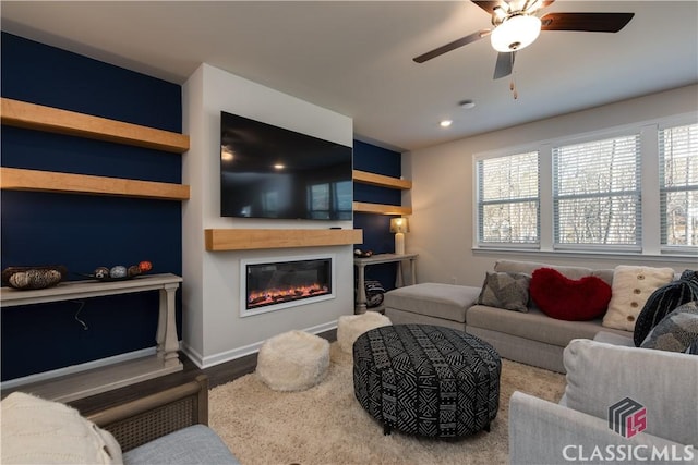 living room with hardwood / wood-style flooring and ceiling fan