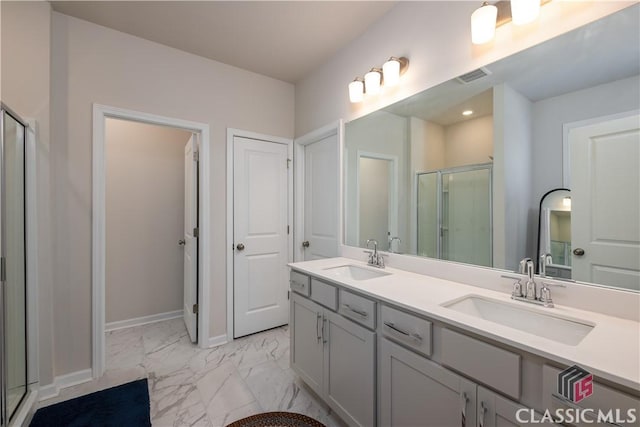 bathroom with vanity and an enclosed shower