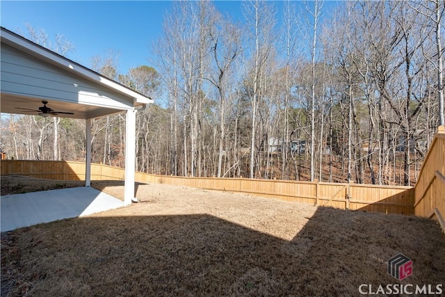 view of yard with a patio and ceiling fan