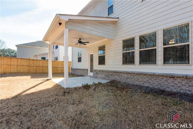 back of house featuring ceiling fan and a patio area