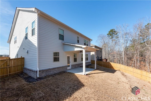 rear view of house with a patio